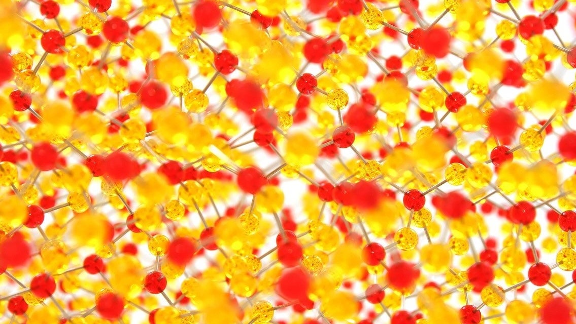 A multilayered rendering of atoms and molecules of varying colors suggests a complex structure at work.